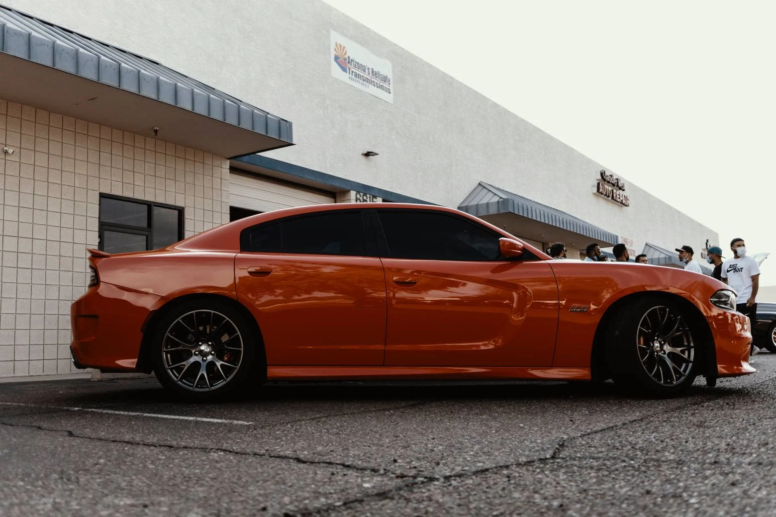 An orange Dodge Charger SRT8 outside Arizona’s Reliable Transmissions shop